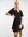 Nette mini-jurk met knopen, gestrikte achterkant en uitlopende mouwen in zwart