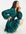 Mini-jurk van voile met guipirekanten rand en veters aan de achterkant in groen