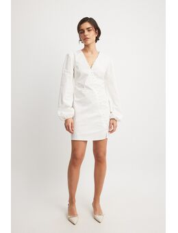 Asymmetrische mini-jurk met lange mouwen en knopen - White