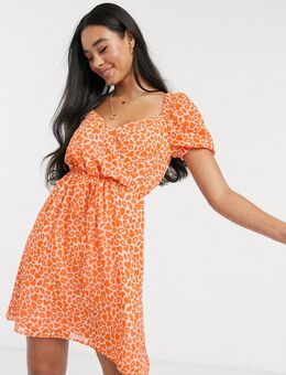 Mini-jurk met lippen- en hartjesprint in neon oranje