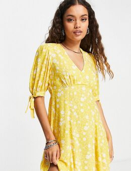 Mini-jurk met V-hals en gestrikte mouwen in geel met bloemenprint